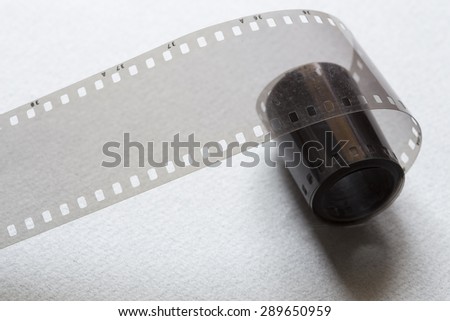 Film strip on a gray cardboard background