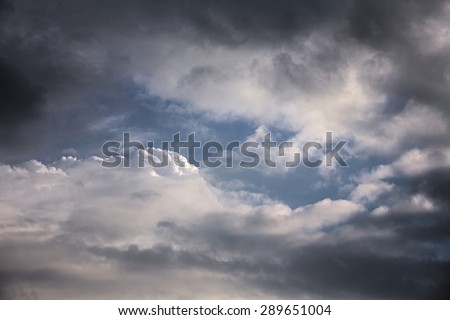 High contrast cumulus cloudscape with blue sky.