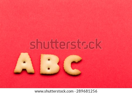 ABC biscuit over the red background