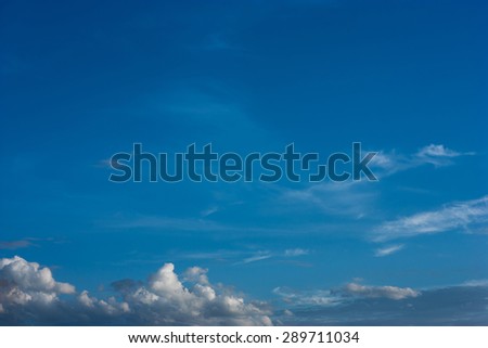 white fluffy clouds in the blue sky, background