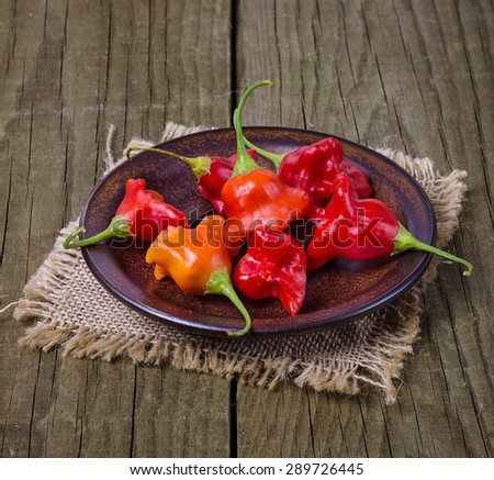 Group of bell shaped Bishop Crown capsicum over rustic wooden background