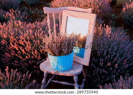 Original wedding decoration in lavender flowers. Wedding accessories in lavender flowers.Chair and mirror in lavender flowers.