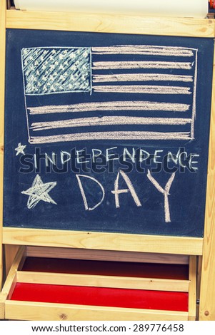 Figure symbol of the independence day of America on the black drawing Board