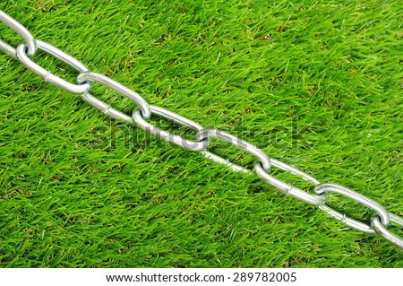 Silver iron chain, green background