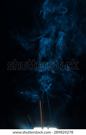 Abstract white smoke on black background, smoking joss sticks