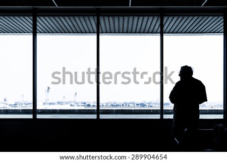 Lonely old man waiting for flight aircraft 