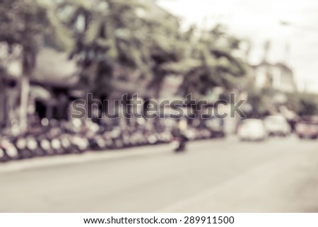 blur image of car on road in daytime,vintage filter