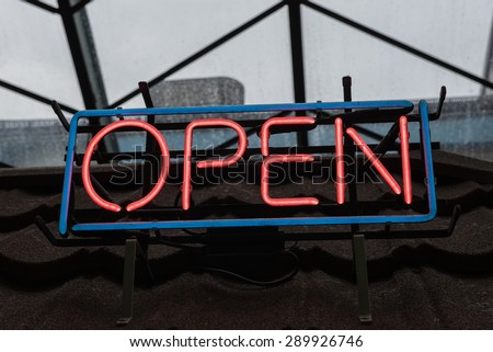 Open Neon Sign on the roof.