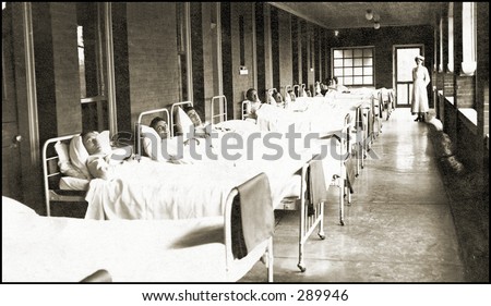 Vintage photo of a Hospital Hallway Lined With Men In Beds