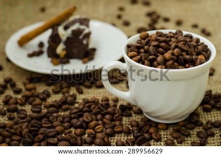 
Still life with coffee bean and cup of coffee