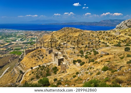 Greece. Aerial view of Acrocorinth (the acropolis of ancient Corinth). There is the Corinthian Gulf in the background Royalty-Free Stock Photo #289962860