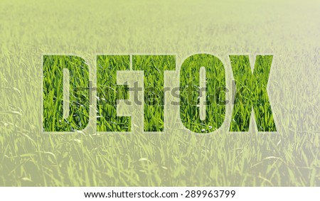 Background with fresh green grass symbolizing the rebirth and the inscription DETOX. Detoxification helps rid the body of toxins. Alternative medicine Royalty-Free Stock Photo #289963799