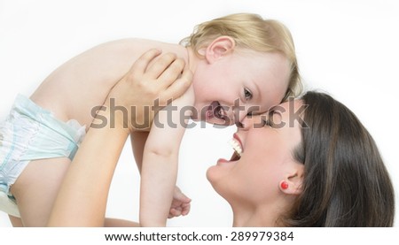 Young Mother Playing with her Little Baby