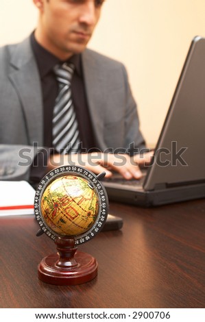 business concept with focus on mini globe