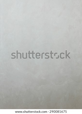 the wall surface with a gray textured beautiful stylish silk decorative plaster