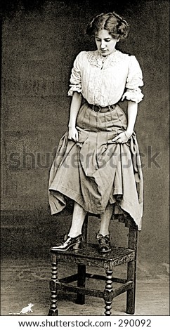 Vintage photo of a Woman On Chair Looking Down At Mouse