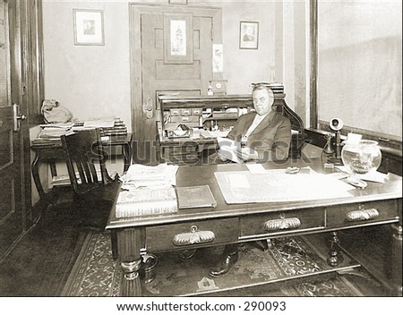 Vintage photo of a Stern Looking Banker In His Office