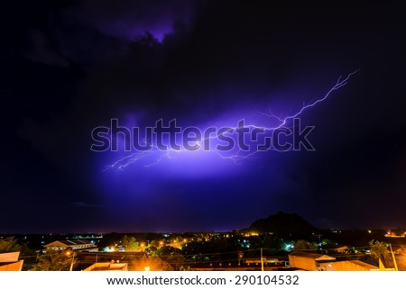 Lightning thunder storm above village