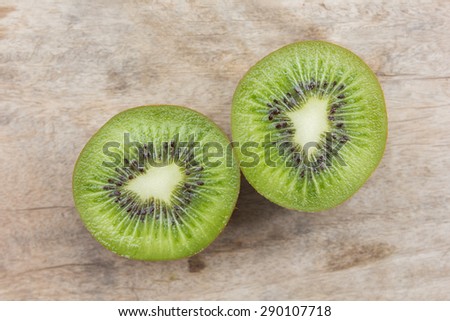 Kiwi fruit on wooden background.
