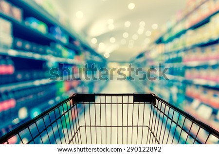 Abstract blurred photo of store with trolley in department store bokeh background Royalty-Free Stock Photo #290122892