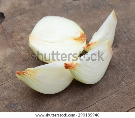 Ripe onion on wooden board