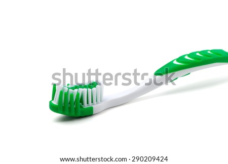Green toothbrush isolated on white background