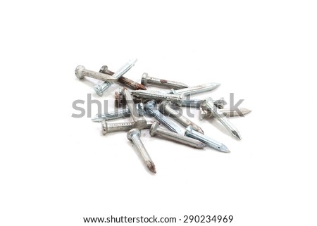 Metal nails with shadow on white background