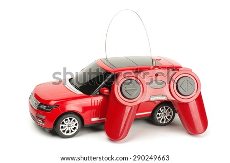 Radio controlled car with control joystick isolated on the white background Royalty-Free Stock Photo #290249663
