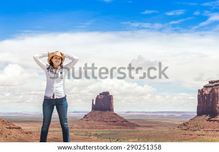 Young woman wearing straw hat in Monument Valley, Utah, USA