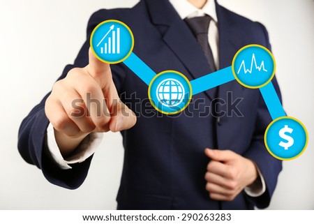 Businessman hand touching icon on screen, close-up