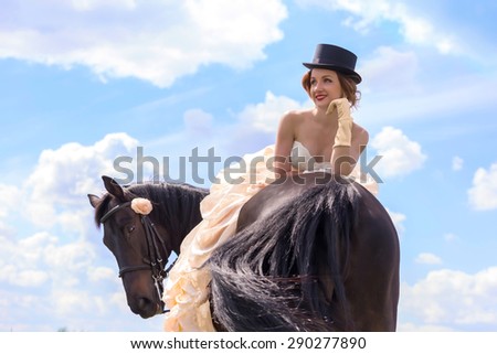 Beautiful girl in vintage dress and her horse
