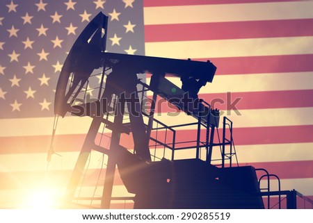 Oil pump on background of flag of USA