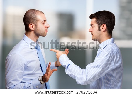 Businessman scolding a colleague Royalty-Free Stock Photo #290291834