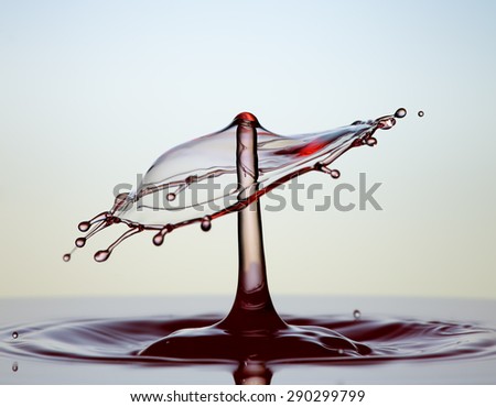 Colorful splashing. Water drop close-up. Royalty-Free Stock Photo #290299799