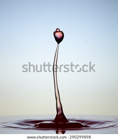 Colorful splashing. Water drop close-up. Royalty-Free Stock Photo #290299898