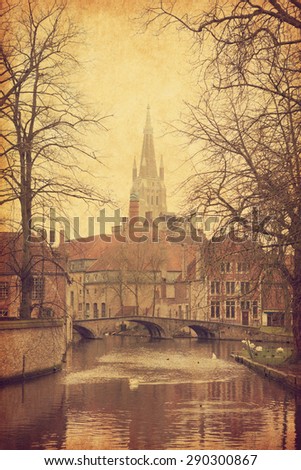 One of  Bruges' canals, Belgium. Photo in retro style. Added paper texture.