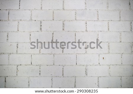 White grunge brick wall background with vignette