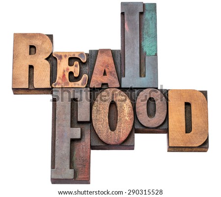 real food word abstract - isolated text in mixed letterpress wood type printing blocks - healthy eating and lifestyle concept