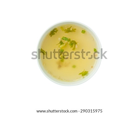 Clear soup in white bowl isolated on white background. Royalty-Free Stock Photo #290315975