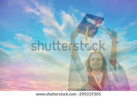 Beautiful female graduate wearing a graduation gown
