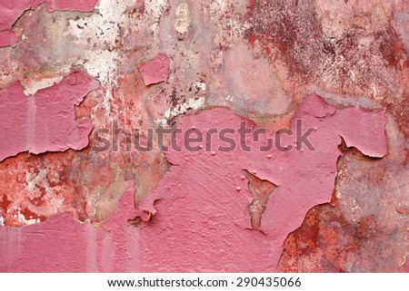 Wall shriveled with scratches. Red color paint. Ancient backdrop.
