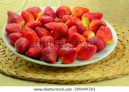 Fresh Strawberry on a Wooden Rustic Dish on a Braided Coaster/Fresh  Red Strawberries