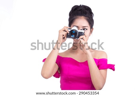 Woman holding a camera on a white background.