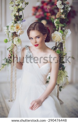 Portrait of Young Beautiful Attractive Bride with Flowers. White Dress and Wedding Decorations. Vintage Toning