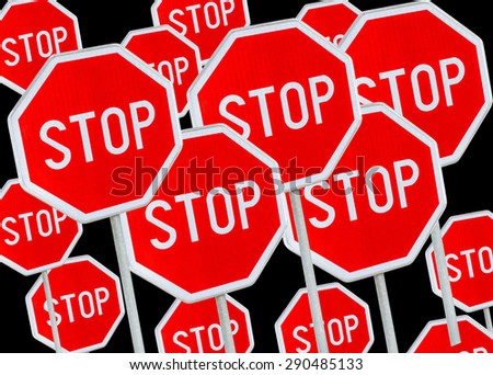 Multiple stop sign against black background 