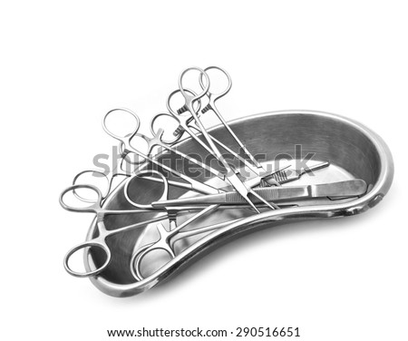 Forceps and medical scissors put in tray, Medical equipment.