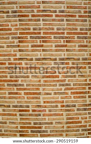 Colorful ceramic tiles imitating bricks on convex wall
