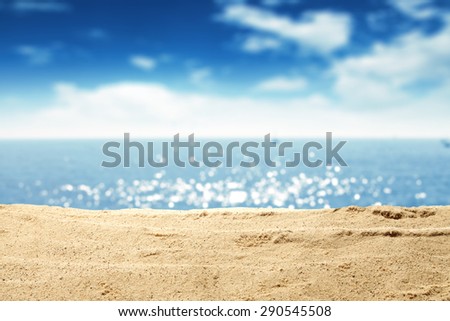 yellow warm sand and summer sea with sky and free space  Royalty-Free Stock Photo #290545508