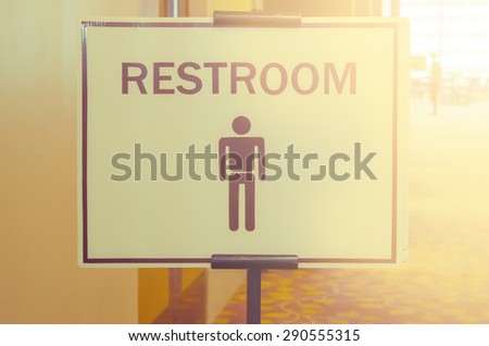 Toilets icon, Public restroom signs with a man symbol and blur vintage filter.