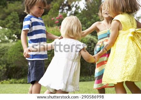 Group Of Children Playing Outdoors Together Royalty-Free Stock Photo #290586998